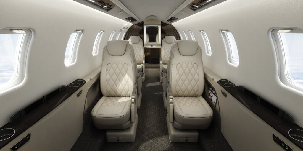 The interior of the Lear 75 features a double club seating arrangement with a 4'11