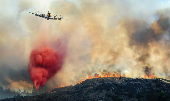 Equipped with four turbine engines, the L-188 Electra air tanker cruises at 330 knots when loaded with retardant. Endurance is approximately four to 4.5 hours of flight time. Richard McGuire/Osoyoos Times Photo