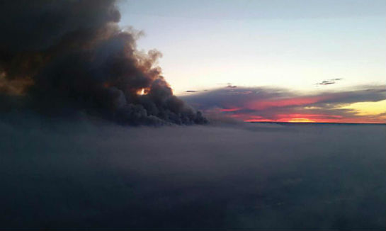 Smoke stains the horizon over Fort McMurray. Paul Spring Photo Smoke stains the horizon over Fort McMurray. Paul Spring Photo