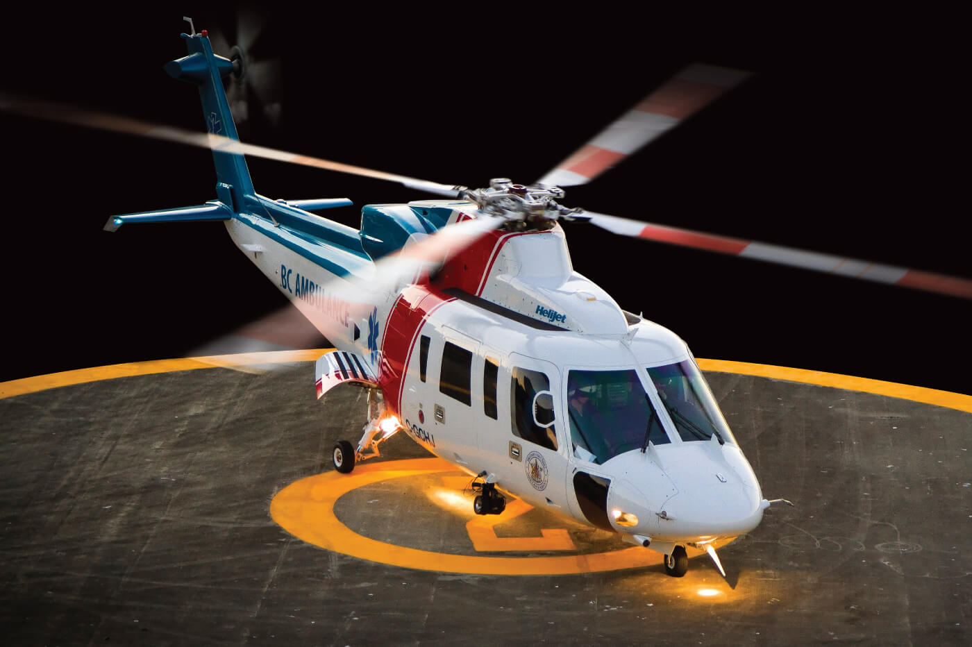 Helicopter rests on helipad
