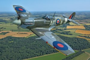 Stephen Grey pilots Spitfire Mk V EP120, former mount of Canadian Ace Squadron Leader Geoffrey Northcutt, just west of the Imperial War Museum Duxford in July 2015.