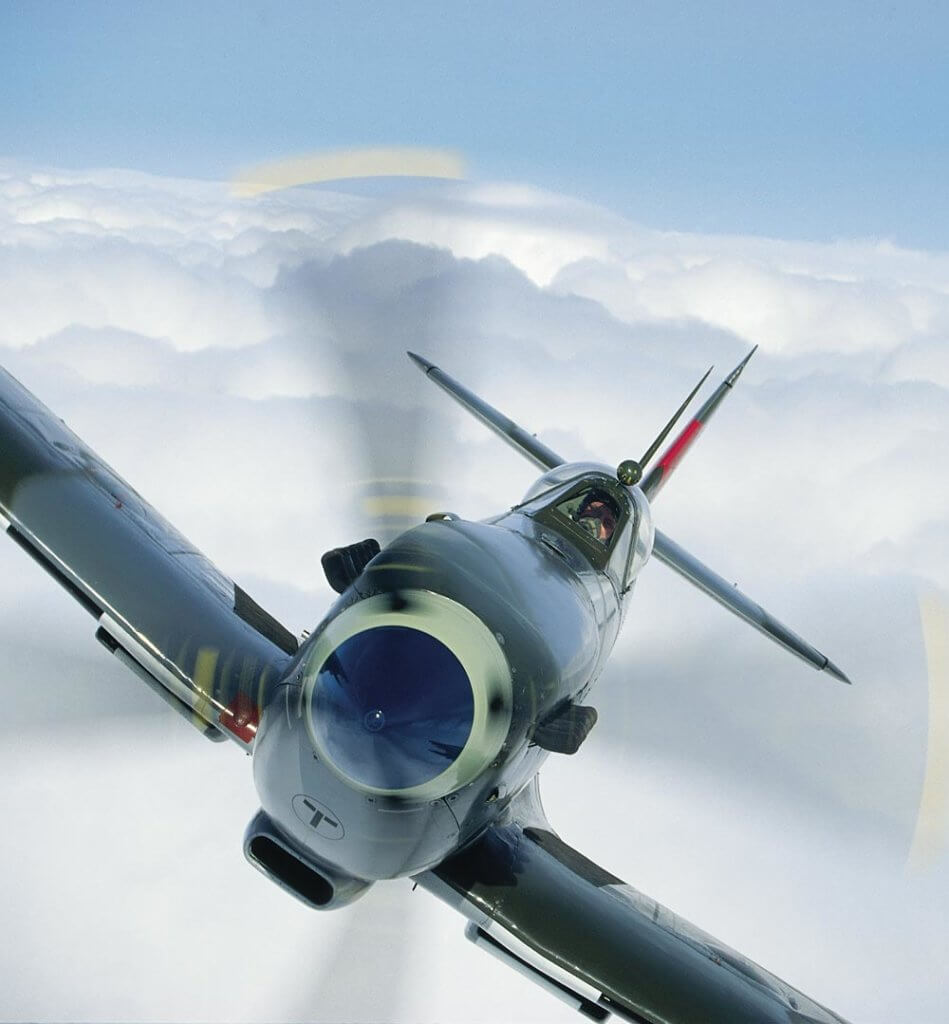 Stephen Grey points the business end of Spitfire Mk IX ML417 towards the lens while the aircraft was with The Fighter Collection at the Imperial War Museum Duxford. It wears the colours it bore during and beyond D-Day with 443 (Hornet) Squadron RCAF. Photos by John M. Dibbs